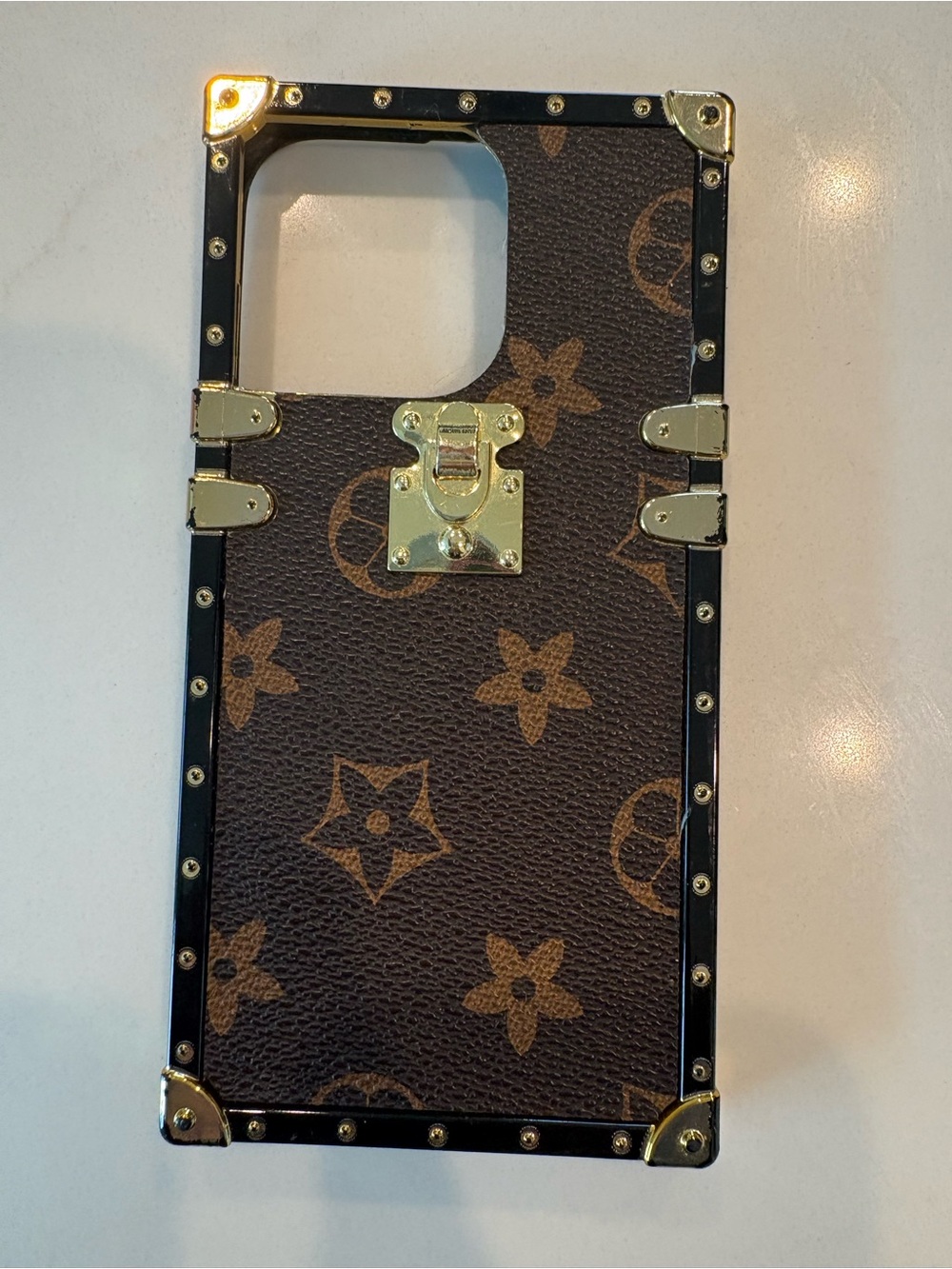 Apple Brown Monogram Trunk-Style Phone Case with Gold Accents